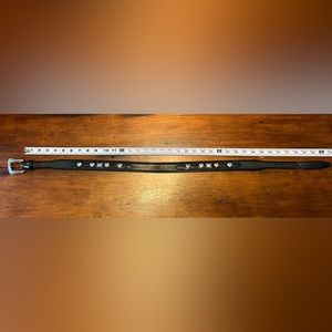 Black leather bonded belt with silver heart embellishments.  Size 32